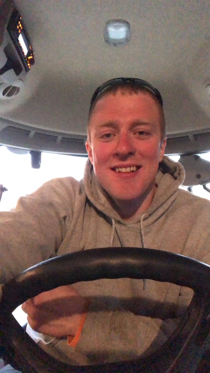 Pierre Melton at the wheel of a tractor